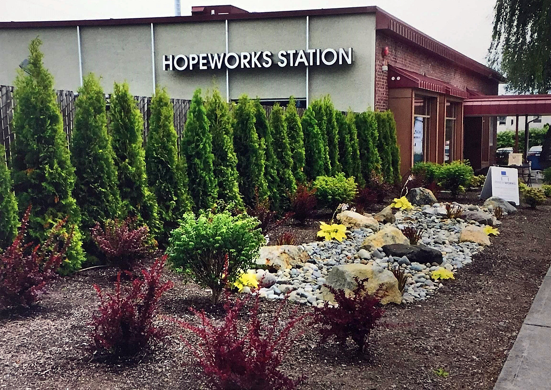 Photo of older landscaping and hardscaping, near HopeWorks Station South.